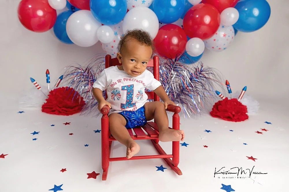 A red, white, and blue firework cake smash for a 4th of July baby